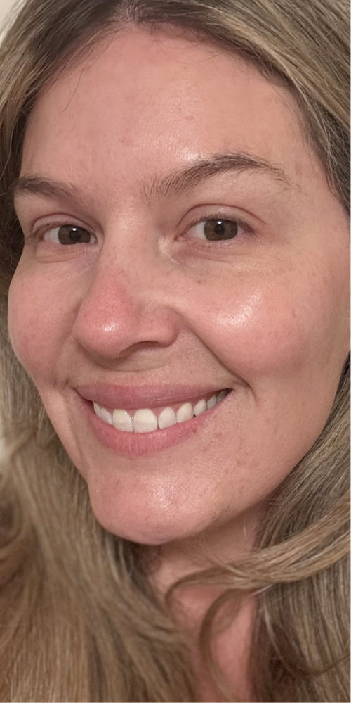 Close-up of a woman's makeup-free face.