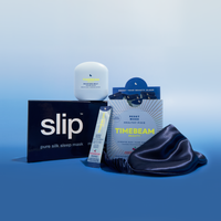 Collection of Timebeam Beauty products including a sleep mask, serum, and supplements
 on a blue background