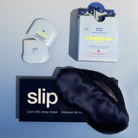 Silk sleep mask, Moisture Melt, and Reset Mode on a light blue background
