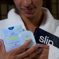 Person holding TIMEBEAM Moisture Melt, Reset Mode and slip products 