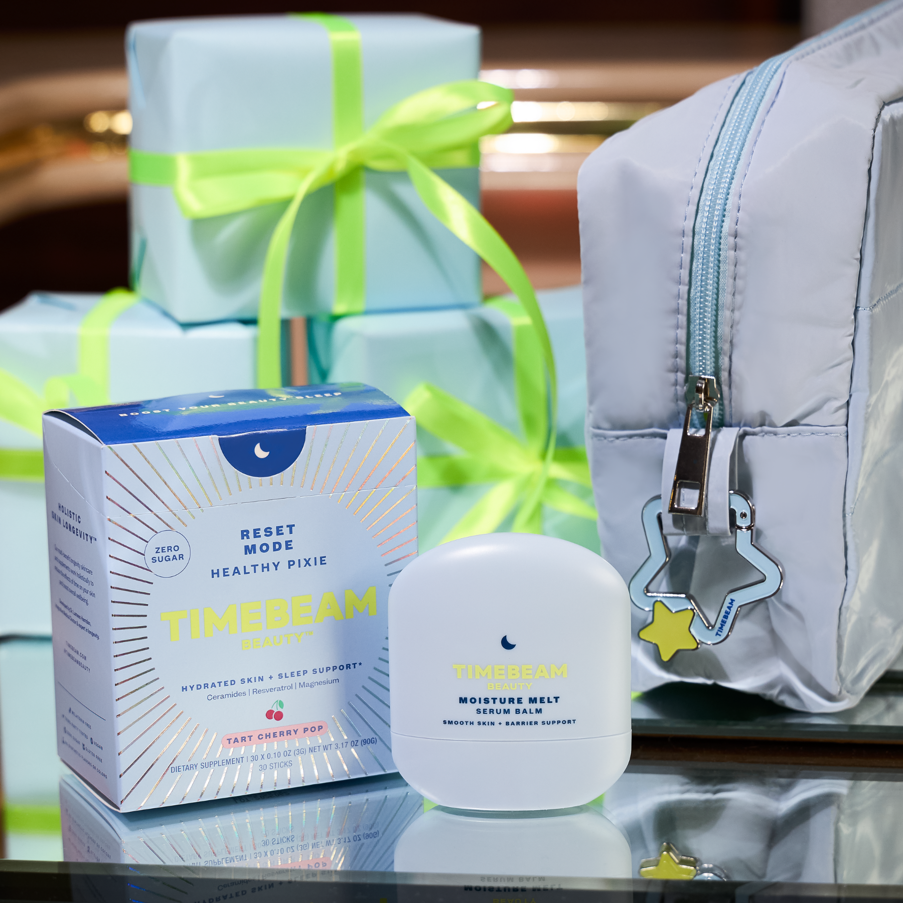 TIMEBEAM product with packaging and a cosmetic bag on a reflective surface.