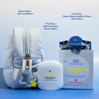 Timebeam beauty products including a pouch, balm, and supplements, star carabiner on a blue background