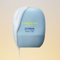 A bottle of TIMEBEAM Milky Serum with white serum dripping down the side.