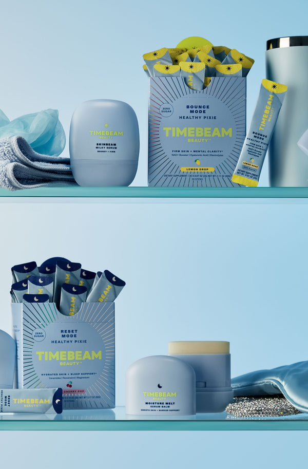 Display of TIMEBEAM products on two glass shelves, surrounded by light-blue objects.