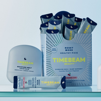 TIMEBEAM product display featuring the Moisture Melt Serum Balm and Reset Mode Healthy Pixie supplements.