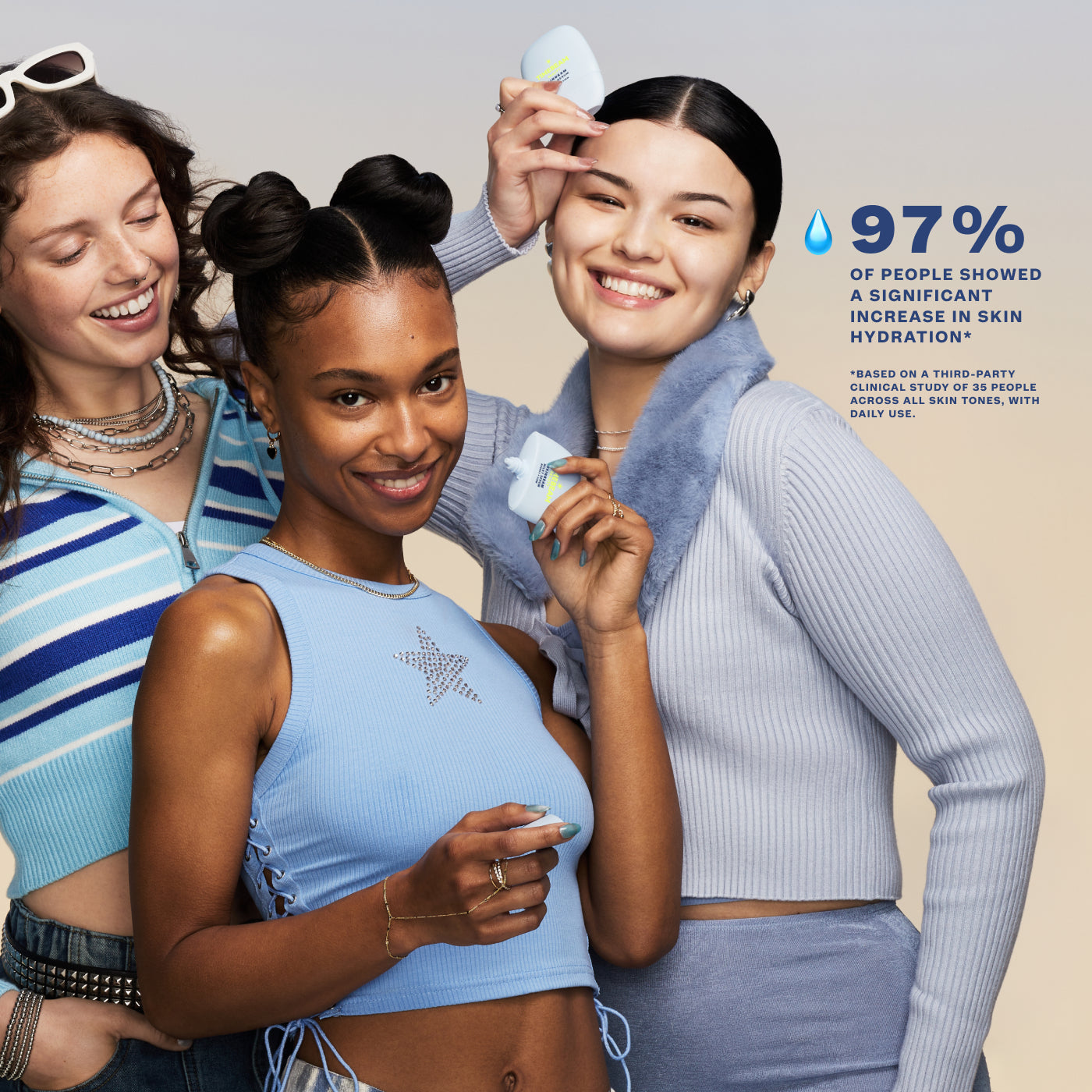 Three smiling women of diverse backgrounds pose joyfully while holding TIMEBEAM Skinbeam Milky Serum bottles.