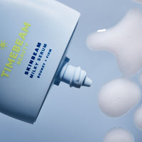 Close-up of a TIMEBEAM Skinbeam Milky Serum bottle dispensing product.