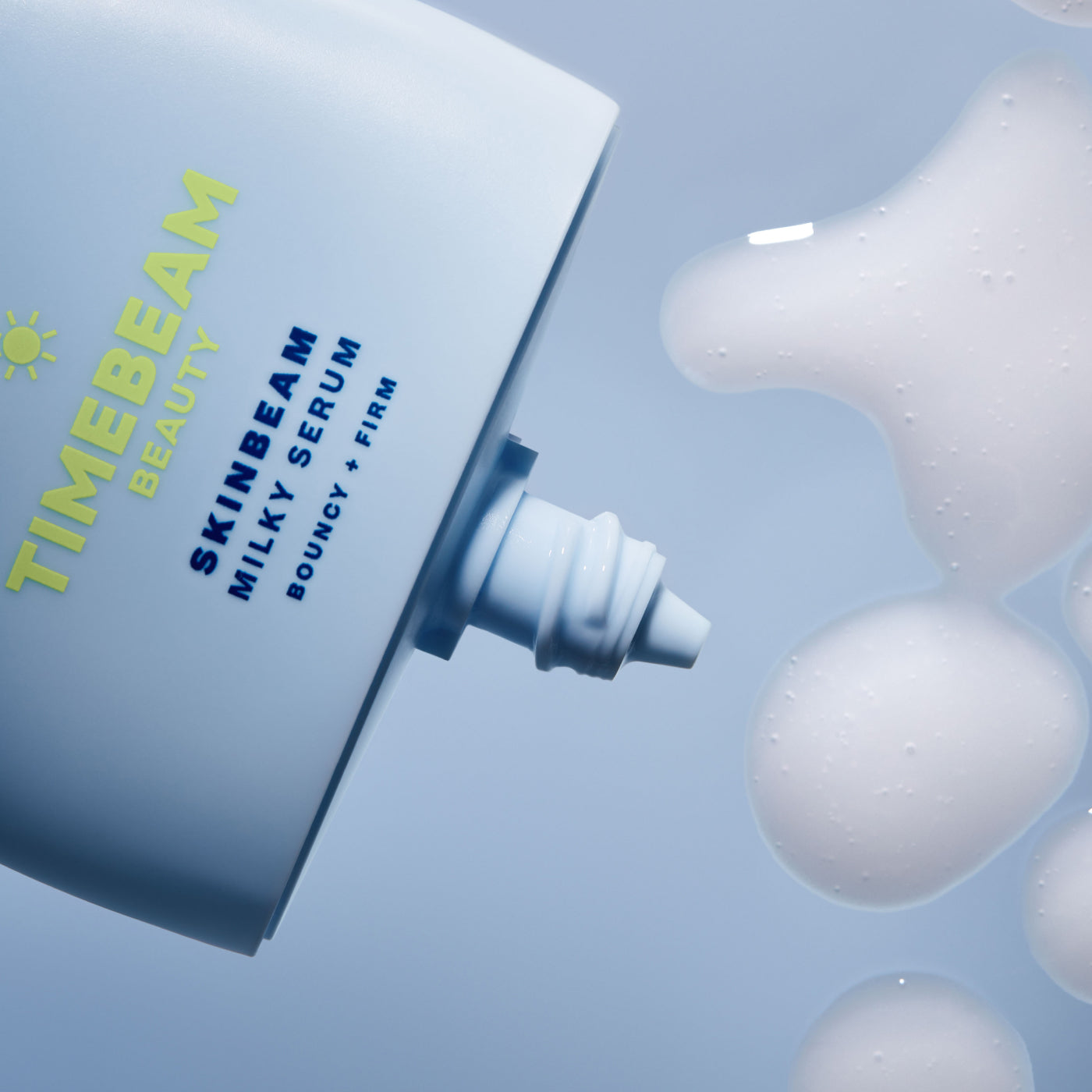 Close-up of a TIMEBEAM Skinbeam Milky Serum bottle dispensing product.