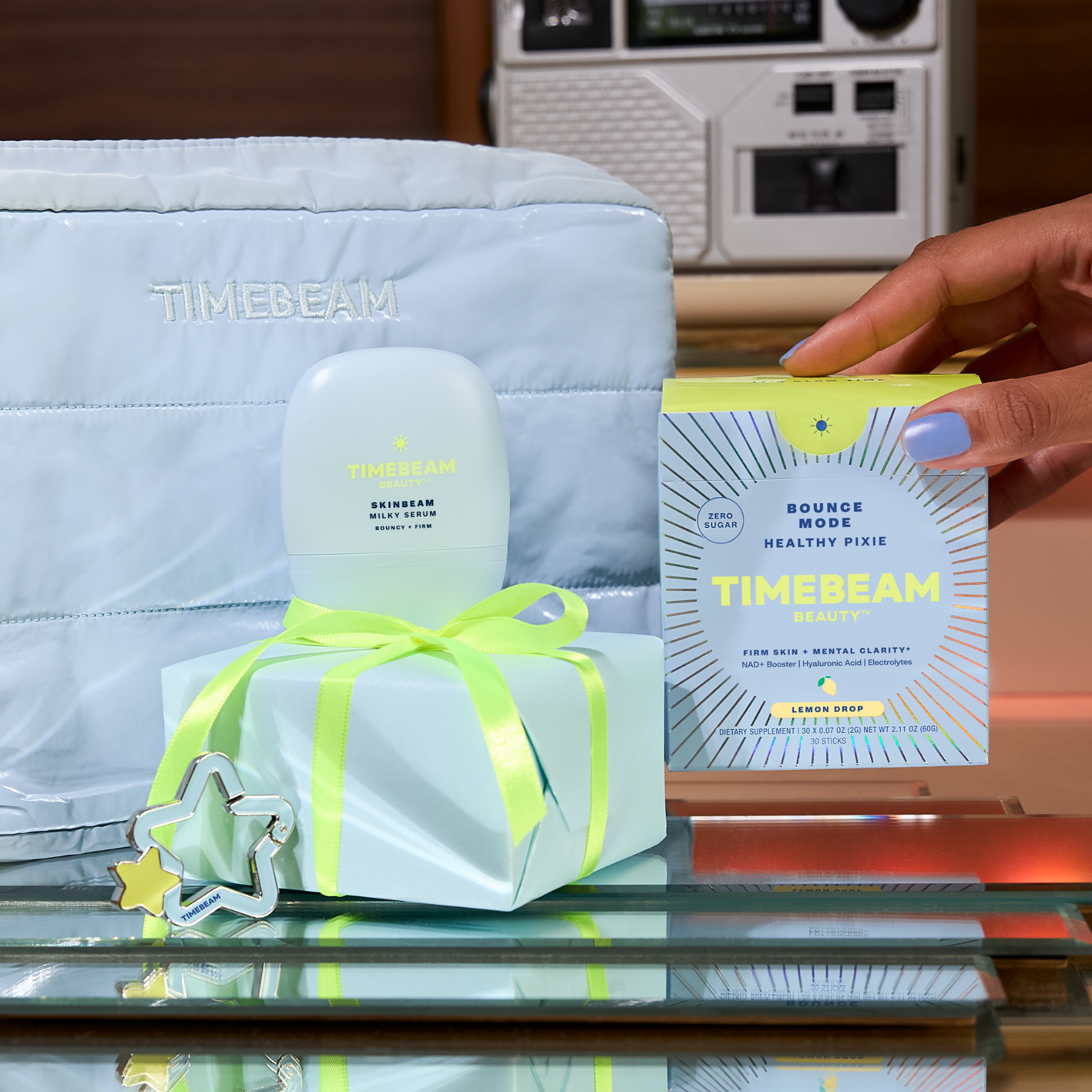 Timebeam skincare product with packaging on a reflective surface, with a hand and vintage radio in the background.