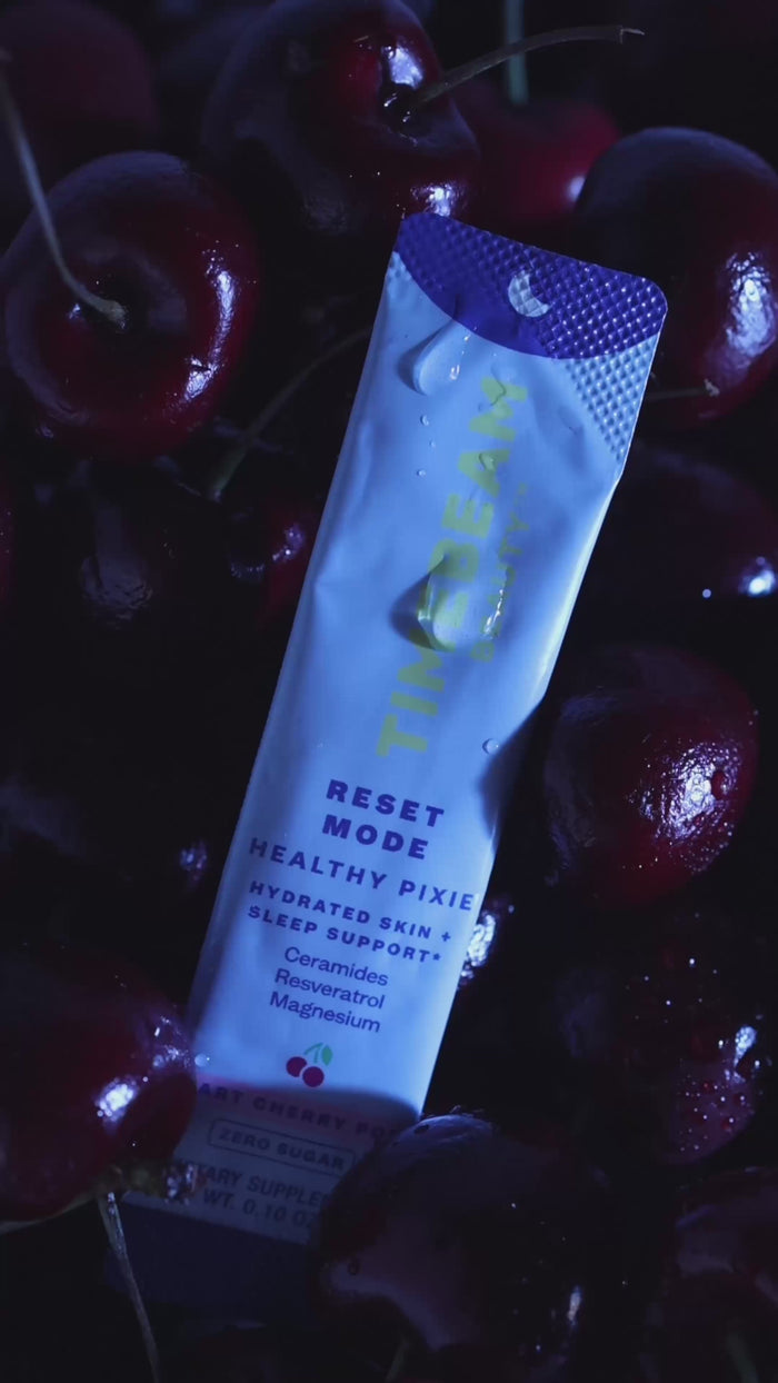 Video of a woman taking TIMEBEAM supplements before going to sleep.