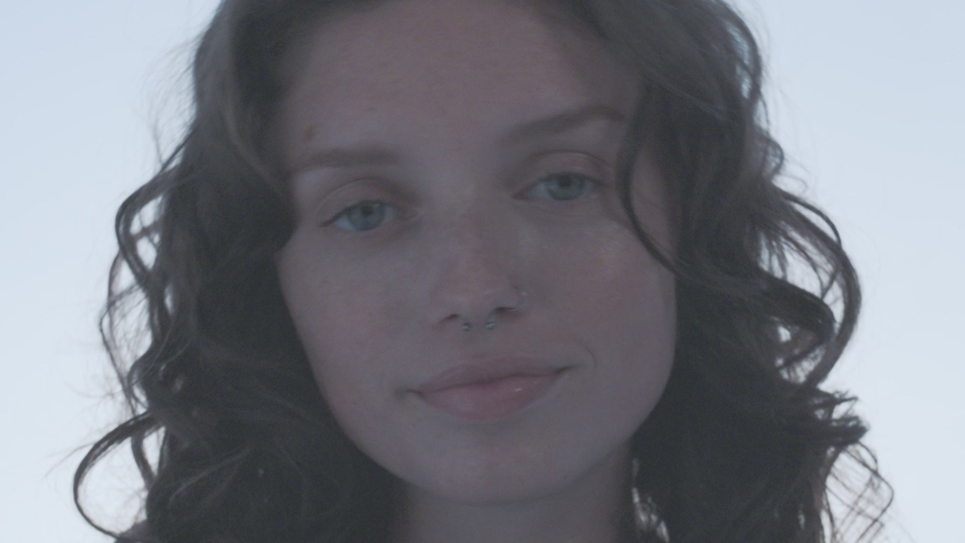 Video of three women's faces without makeup.