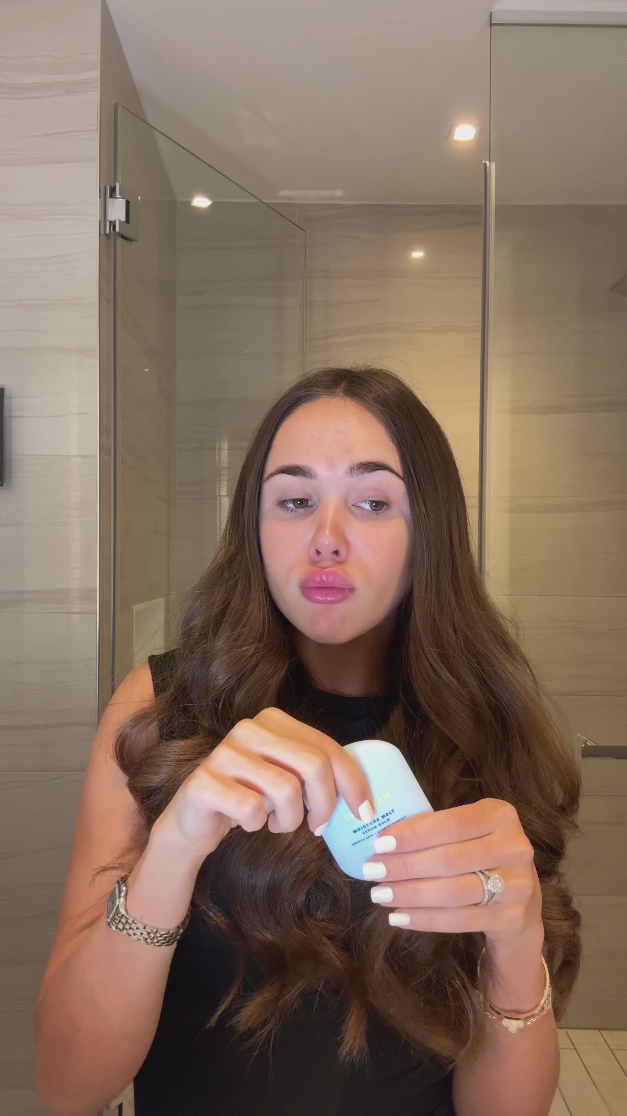 Video of a woman reviewing TIMEBEAM Moisture Melt Balm.