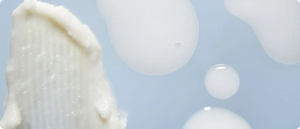 Close-up of creamy and white serum textures.