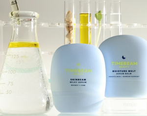 Two TIMEBEAM skincare products displayed beside lab beakers and test tubes filled with natural ingredients.